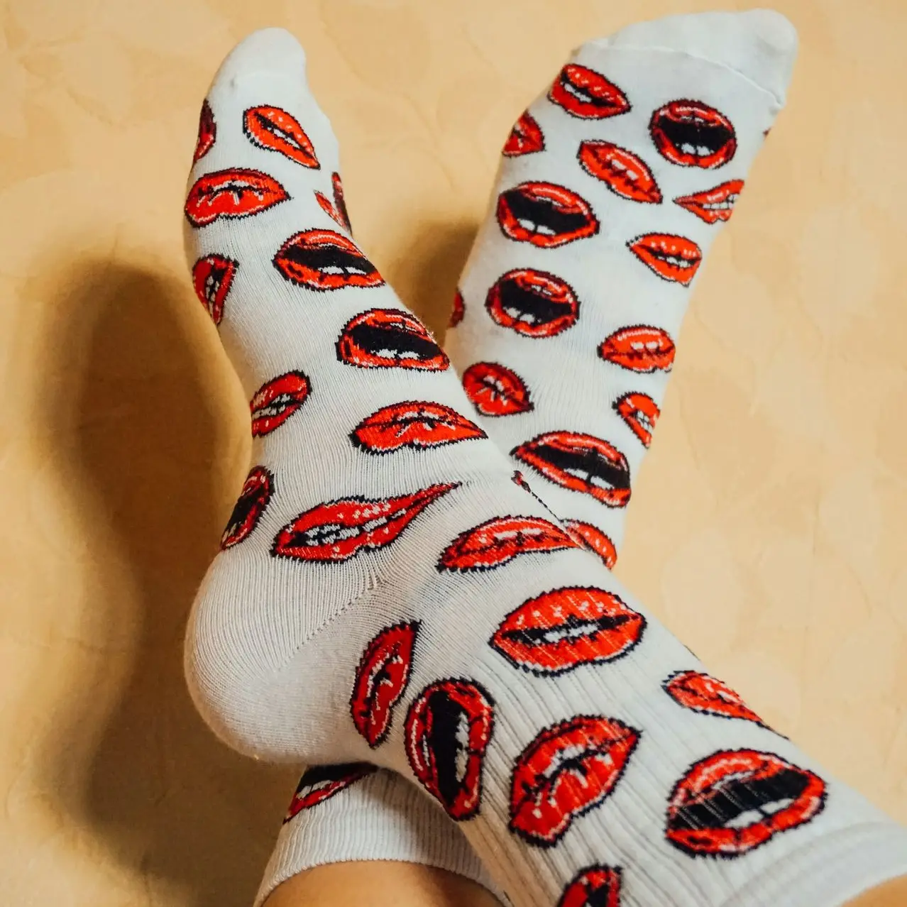 person wearing white and red socks